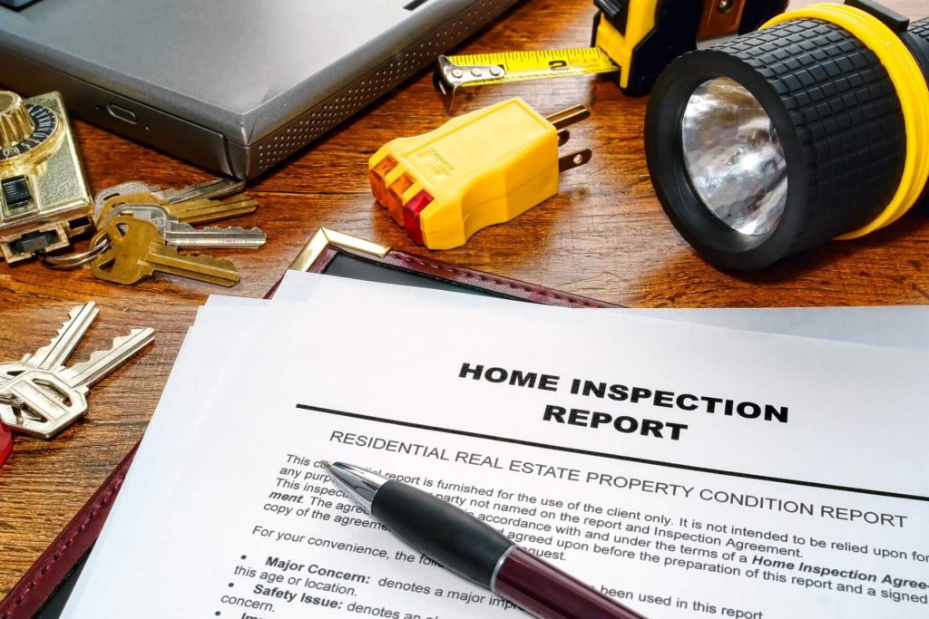 A home inspection report sitting on top of a table.