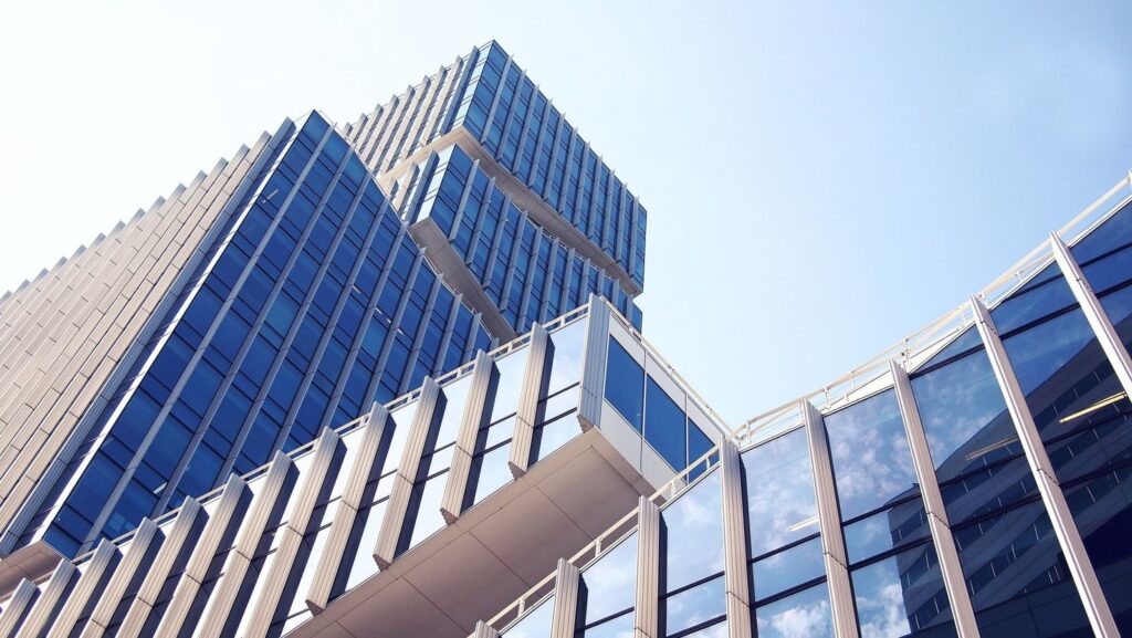 A building with many windows and a sky background