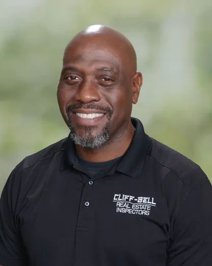 A man in black shirt and white lettering.